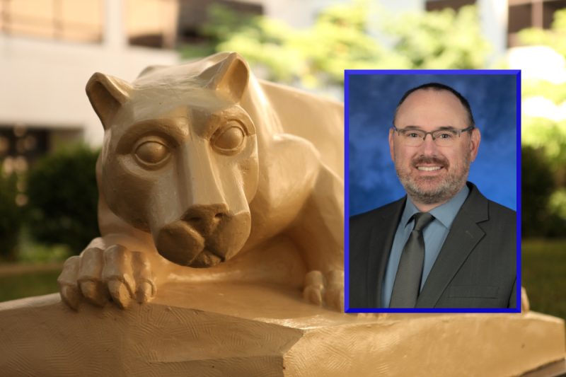 A professional headshot of Bradley Stevens is placed over a photo of a Penn State Nittany Lion statue in an outdoor courtyard.