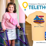 A photo of a young girl holding onto a walker and smiling is positioned next to a graphic that contains the Children’s Miracle Network Telethon logo, WGAL-TV8 logo and a photo of a T-shirt that the girl designed.