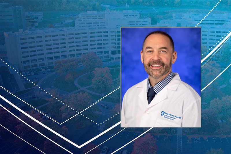 A professional head-and-shoulders headshot of Donald Bucher is superimposed over an image of the campus of Penn State College of Medicine.