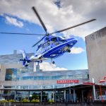 Life Lion medical helicopter approaching the helipad above the emergency department entrance at Penn State Health Milton S. Hershey Medical Center.
